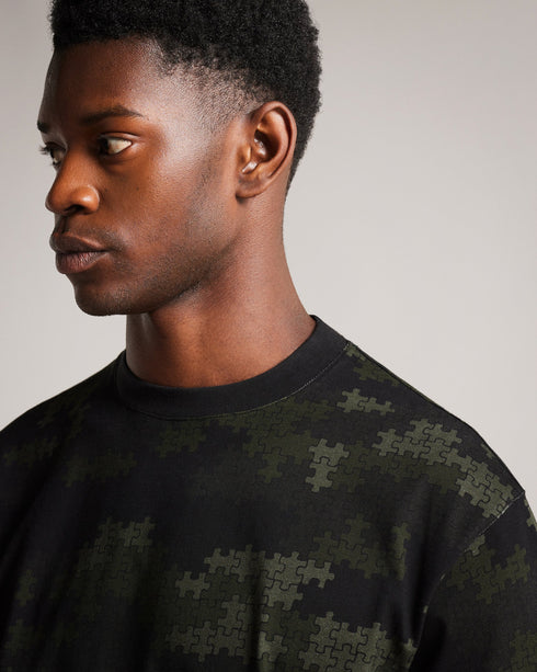 TUGO-Tops-Made from 100% cotton and in a relaxed fit, TUGO perfect for weekend lounging. This quirky camo tee features a relaxed fit, crew neck and short sleeves. Team with jeans and trainers for an easy weekend look.By choosing Ted Baker cotton products, you're supporting our investment in the Better Cotton Initiative's mission. This product is sourced via a system of mass balance and therefore may not contain Better Cotton. T-shirt 100% cotton Relaxed fit Camo jigsaw print Short sleeved Crew neck Grace is
